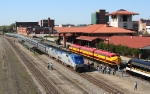 On time NB Crescent going by covered wagons of a different era 